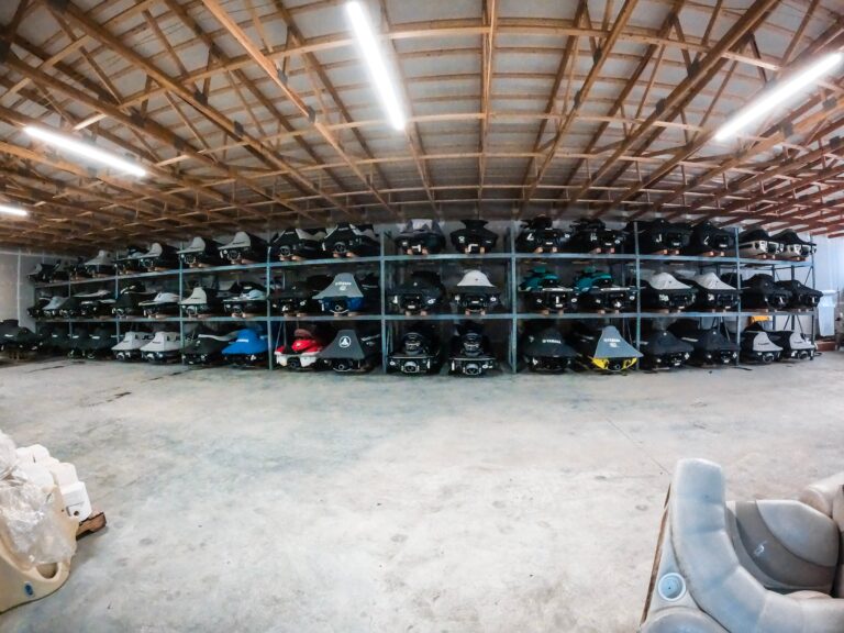 jetskis stored inside of a warehouse