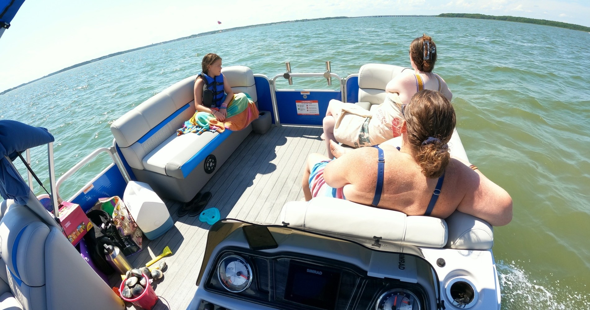 a person sitting in a boat on a body of water