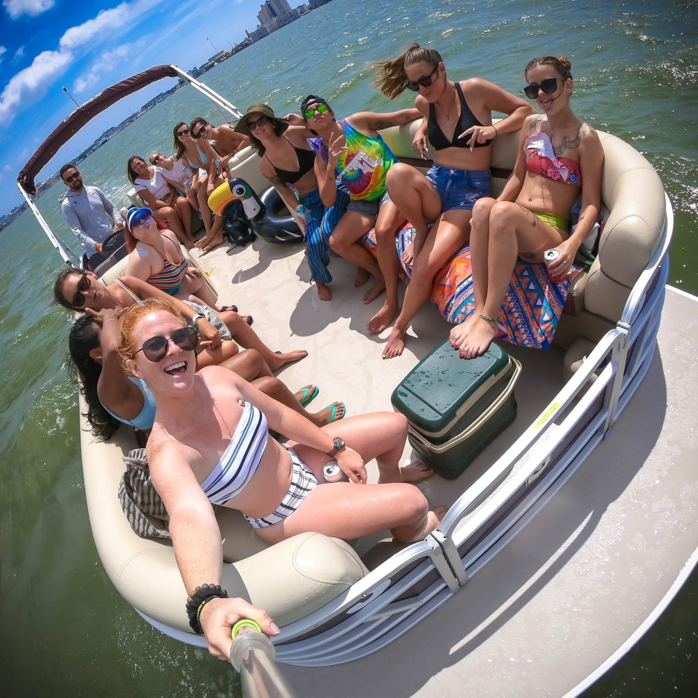 a group of people riding on the back of a boat