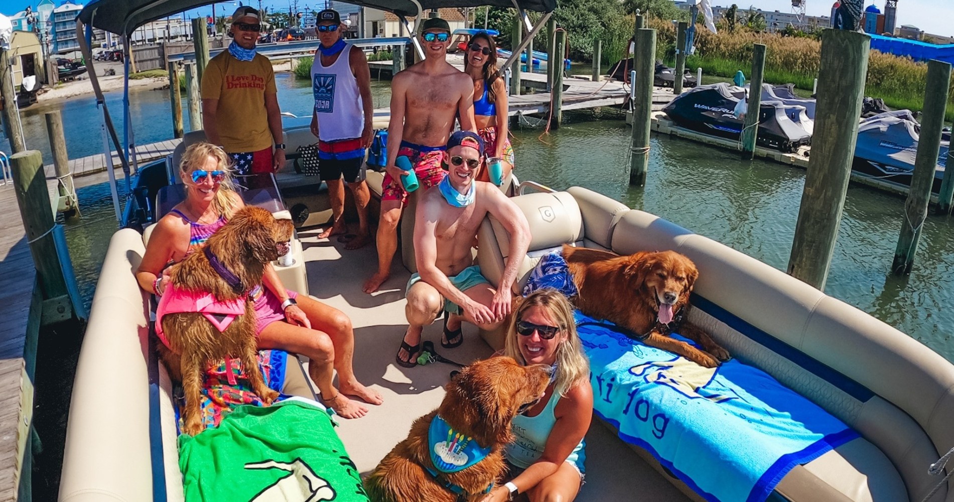 a person sitting on a boat with a dog in a pool of water