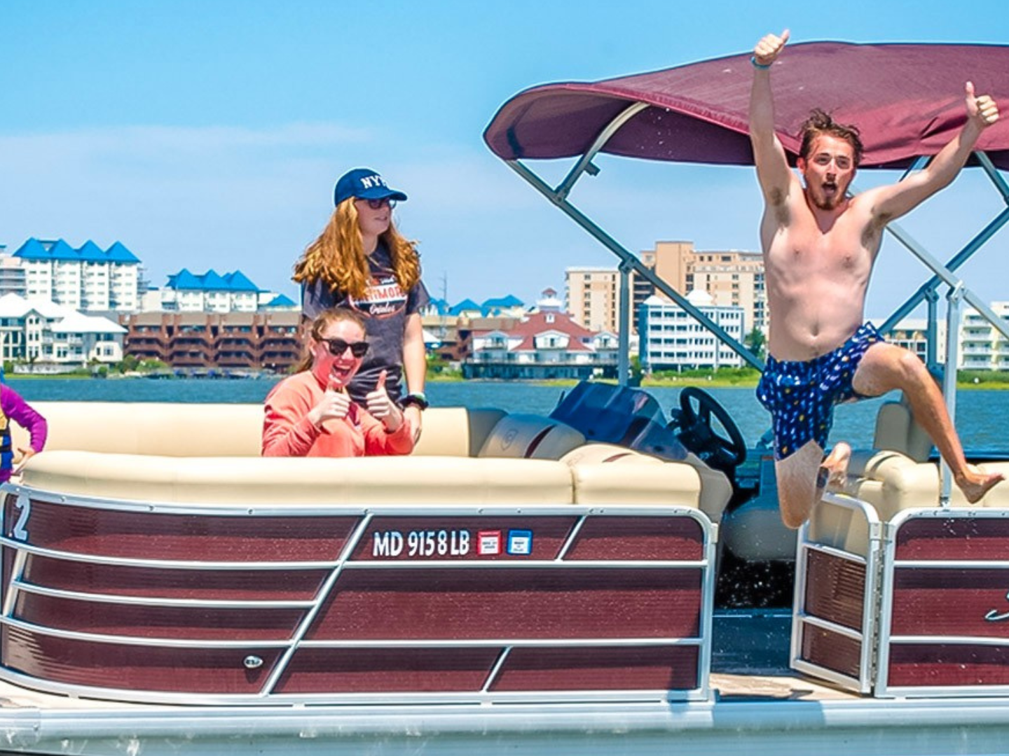 a person riding on the back of a boat