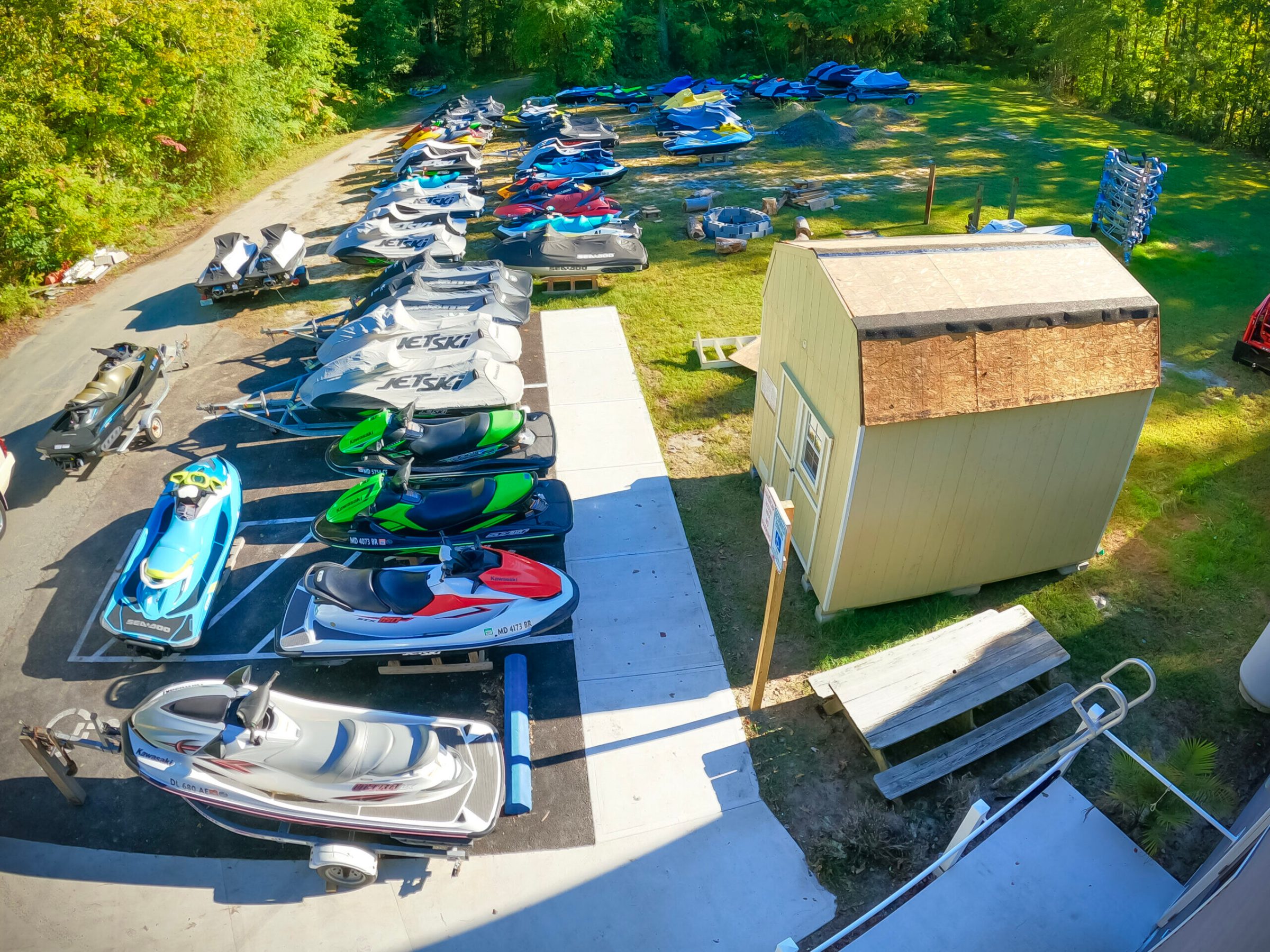 jetski and boats sitting at a service shop